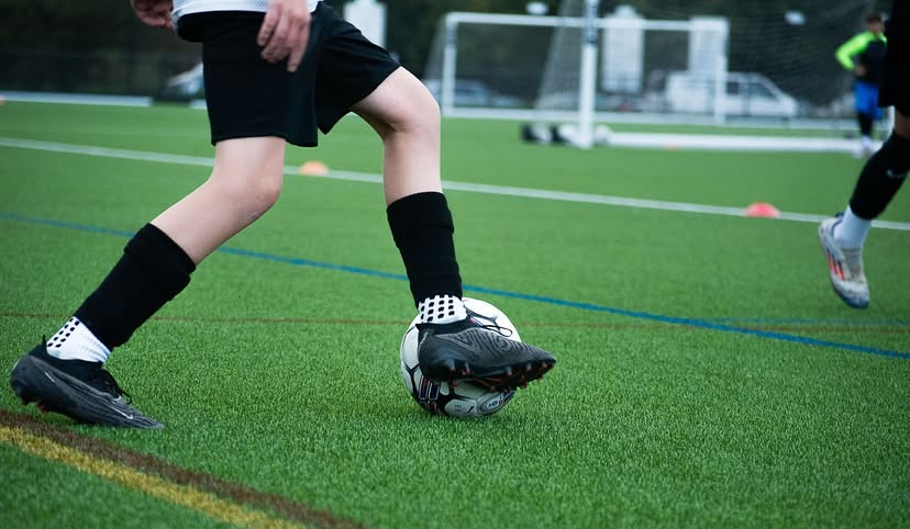 Close-up of a young player controlling the ball during a BRS session